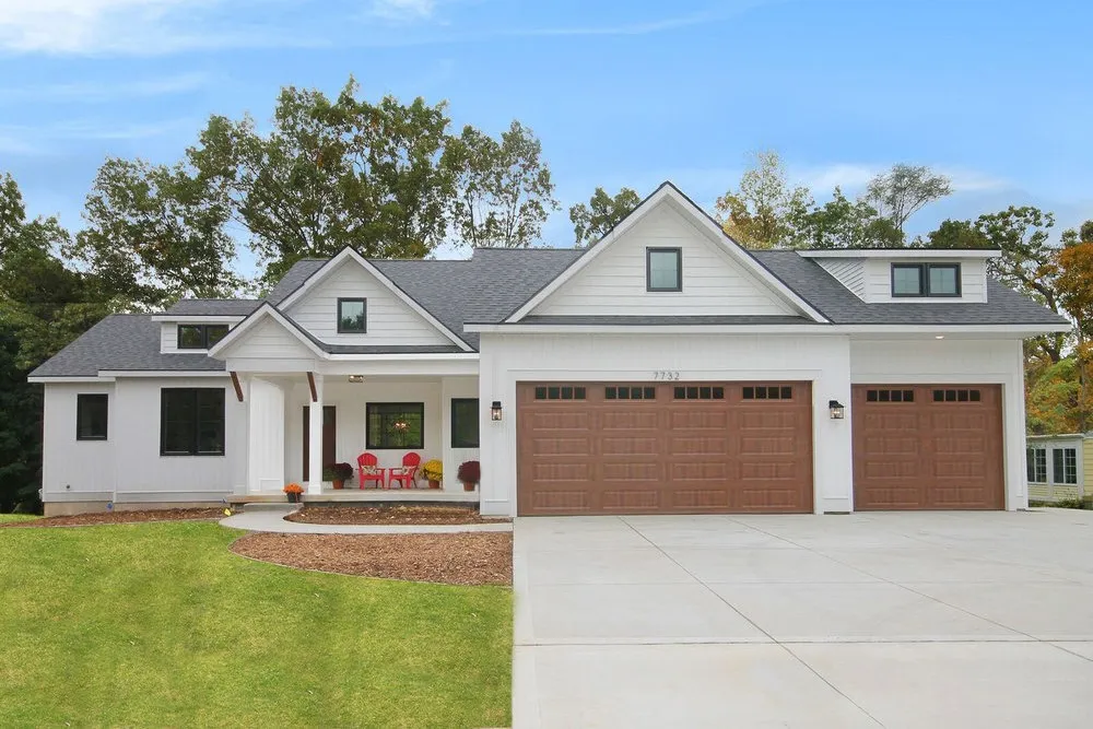 White custom home with three-car garage in Grand Rapids, Michigan