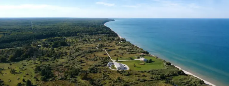 Aerial view of a wooded lakefront property in West Michigan