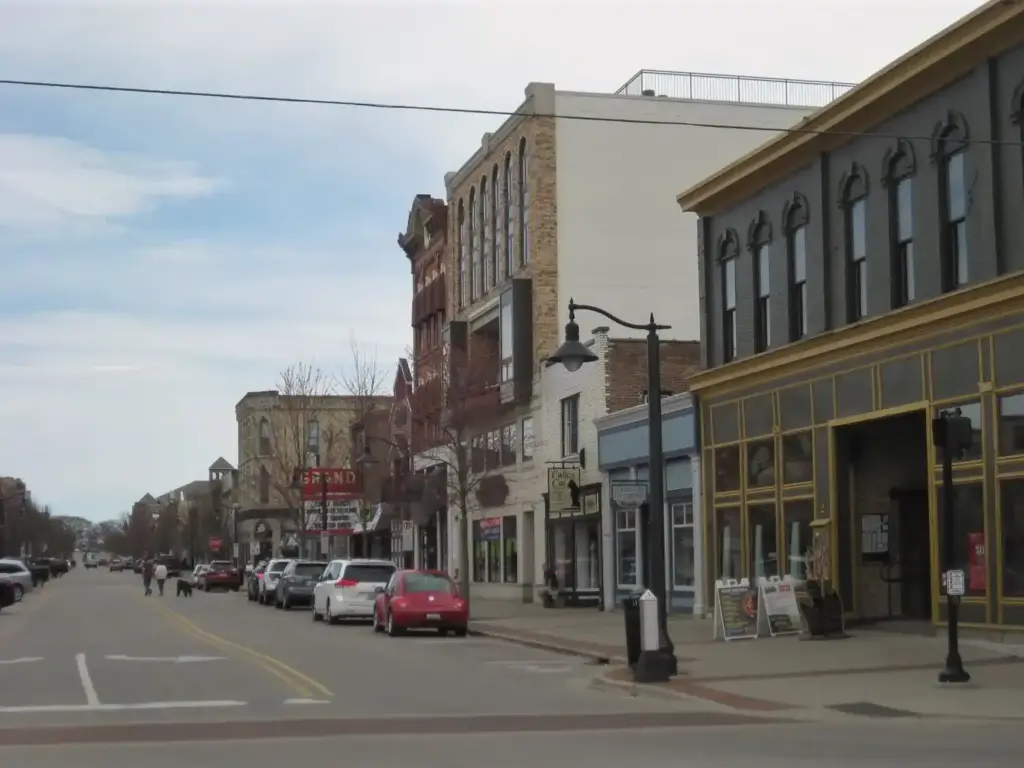 Historic storefronts and local businesses along a downtown Grand Haven, Michigan street