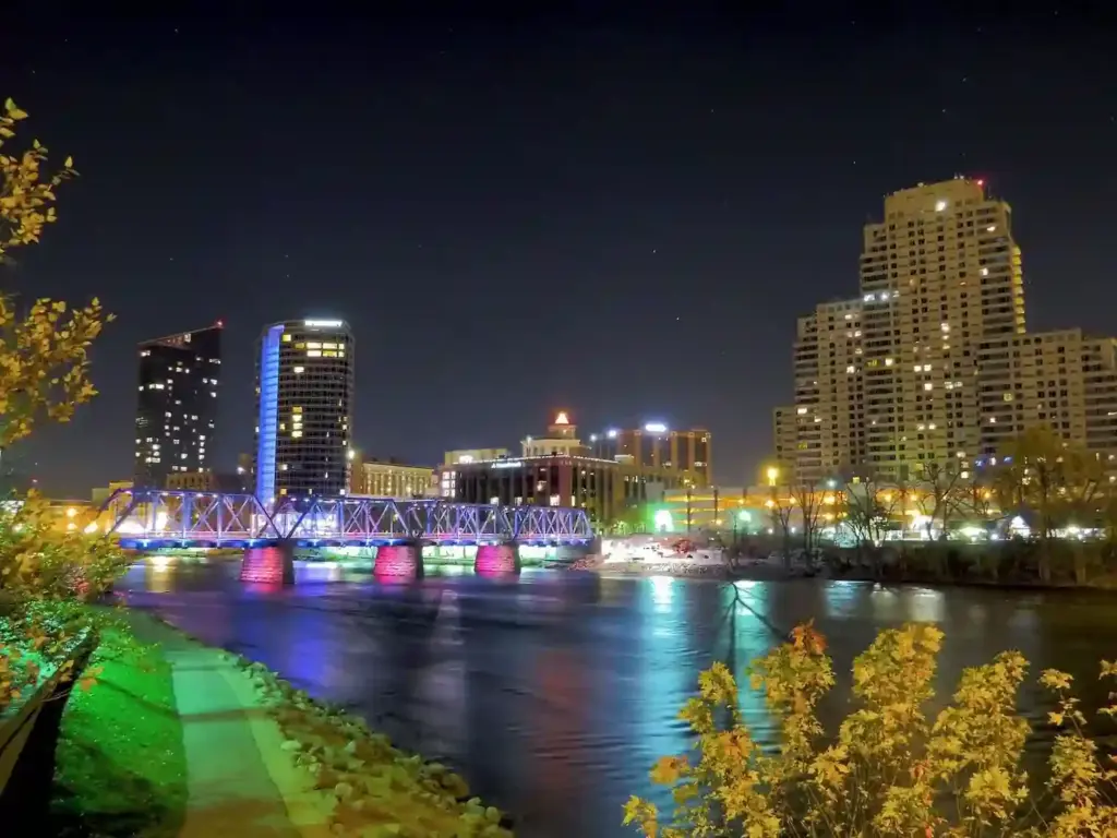 Downtown Grand Rapids skyline and illuminated Blue Bridge over the Grand River at night