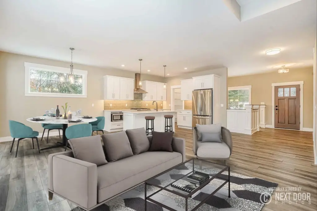 Open-concept living room, dining area, and modern white kitchen in a custom home