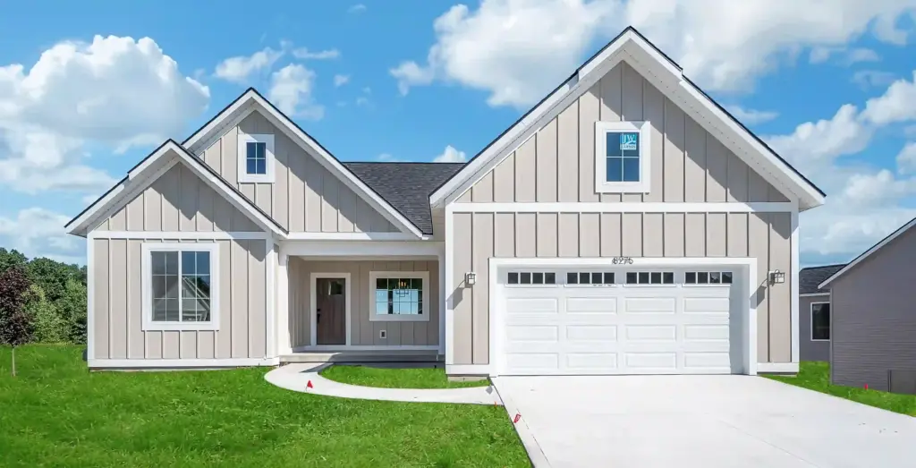 Beige custom home with board-and-batten siding, white trim, and attached garage